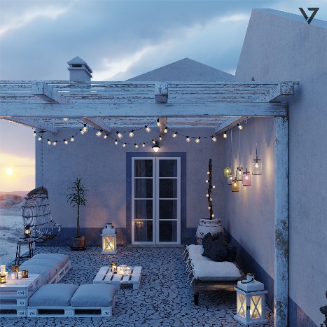 Mediterranean seaside house terrace at sunset with illuminated pergola, decorative lights and outdoor lounge overlooking the coast.